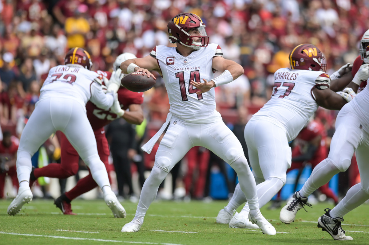 Washington Commanders quarterback Sam Howell (14) is getting better each week, but is still searching for full-game consistency.