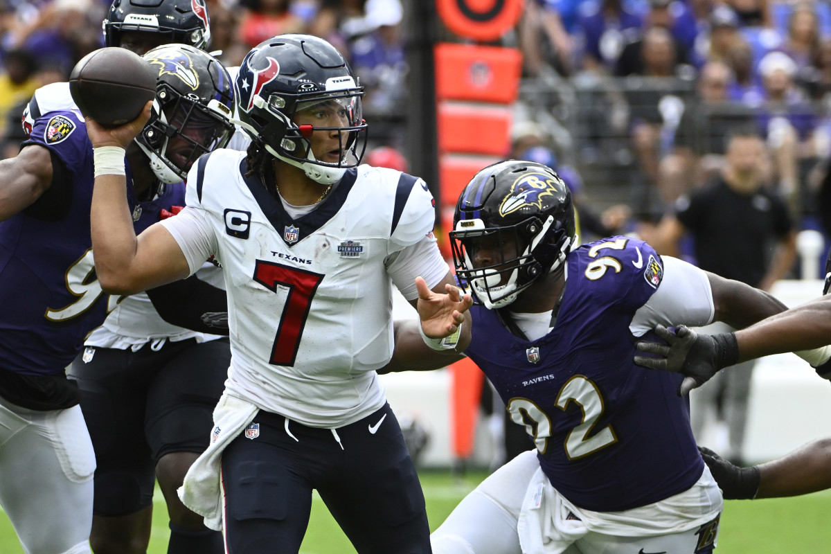Sep 10, 2023; Baltimore, Maryland, USA; Houston Texans quarterback C.J. Stroud (7) attempts a pass as Baltimore Ravens defensive tackle Rayshad Nichols (91) rushes during the second half at M&T Bank Stadium.