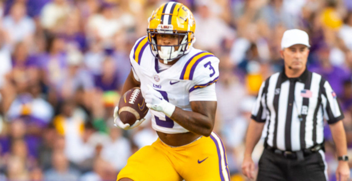 LSU Tigers running back Logan Diggs on a carry during a college football game in the SEC.