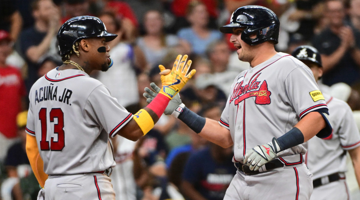 Ronald Acuña and Austin Riley playing for the Braves.