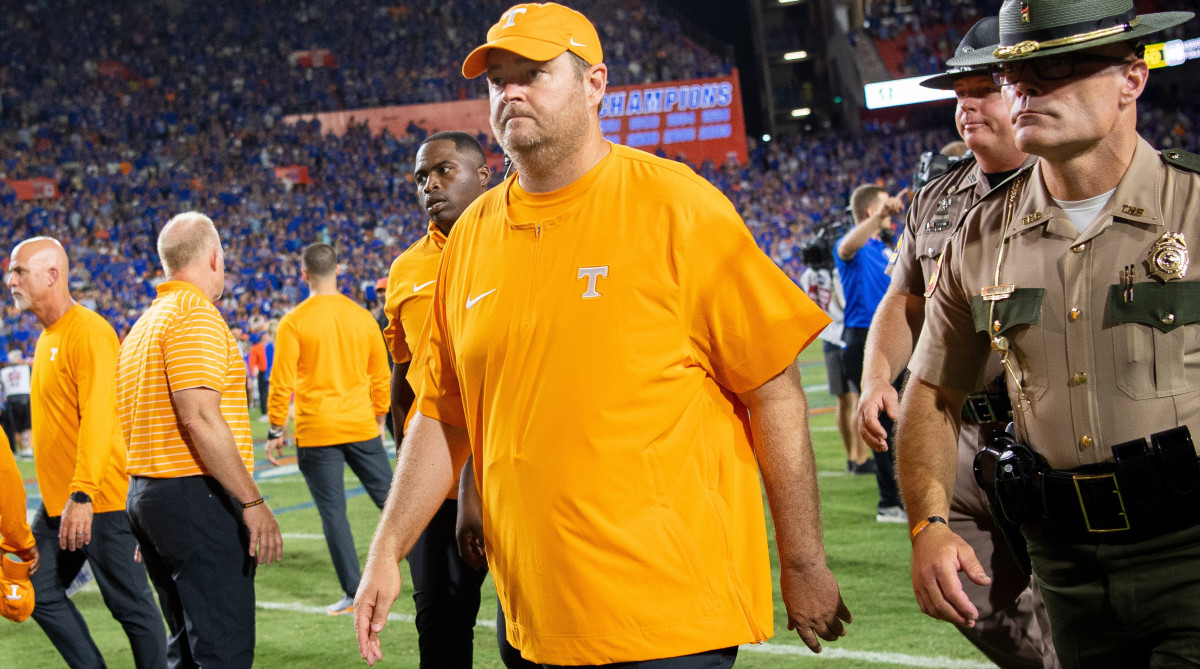 Tennessee head coach Josh Heupel walks off the field with a frown after losing to Florida.