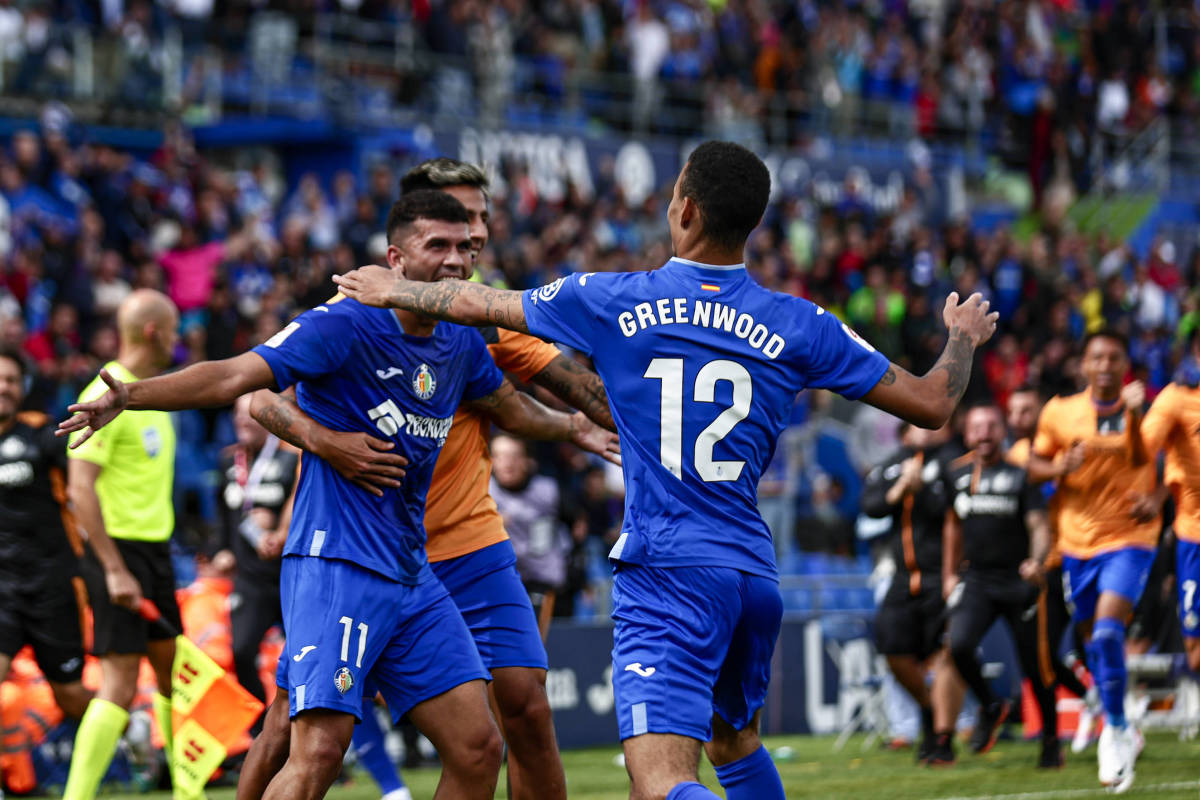 Mason Greenwood pictured celebrating with his Getafe teammates during a 3-2 win over Osasuna on his La Liga debut in September 2023