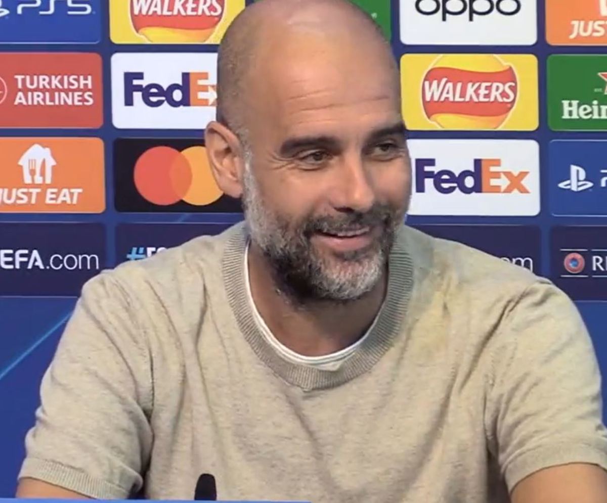 Manchester City manager Pep Guardiola pictured laughing during a press conference in September 2023