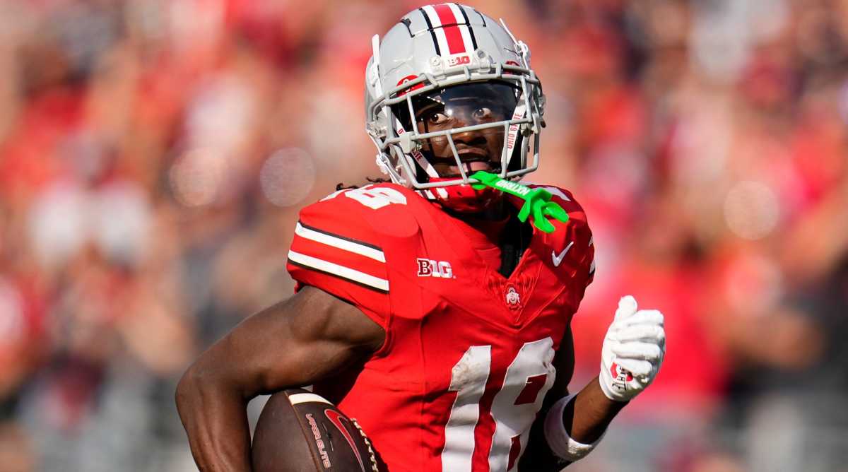 Buckeyes receiver Marvin Harrison Jr. runs with the ball