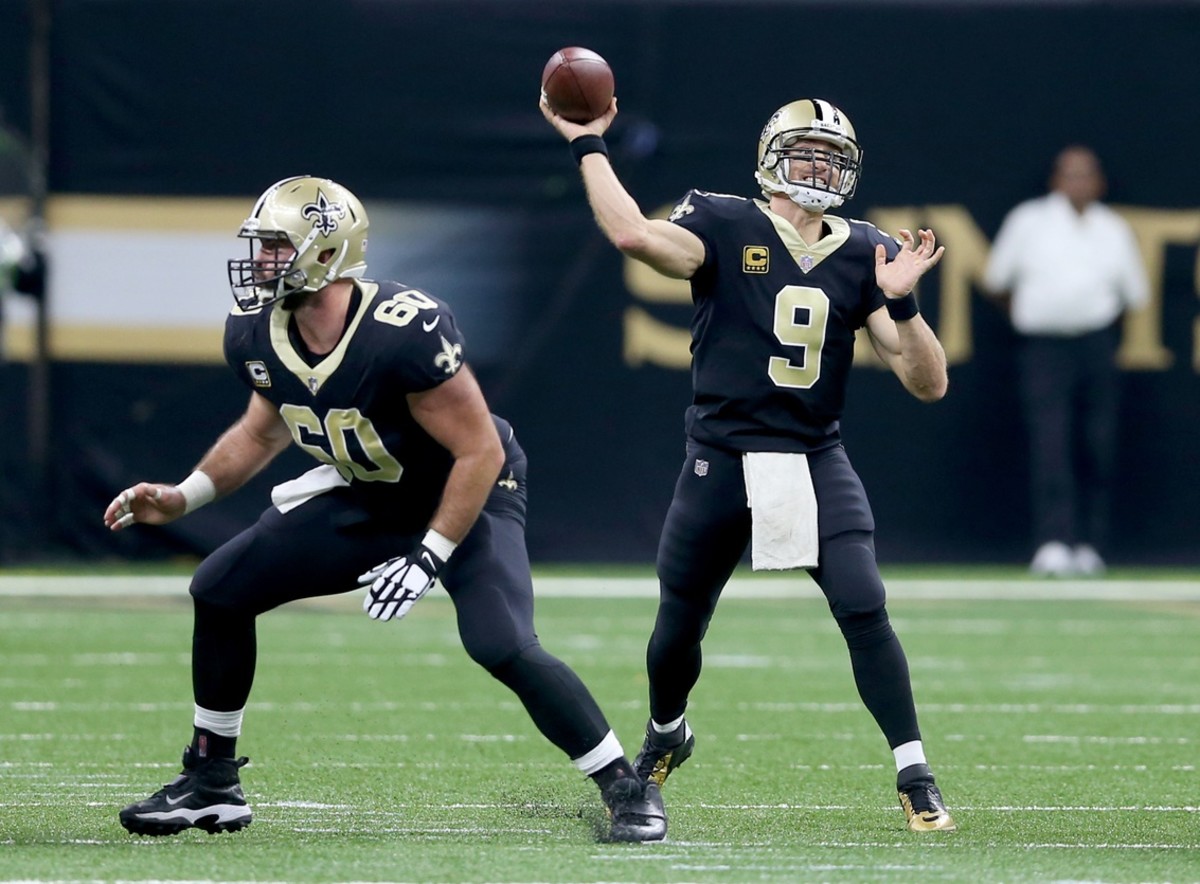 Nov 19, 2017; New Orleans Saints quarterback Drew Brees (9) throws a throw as center Max Unger (60) protects against the Washington Redskins. Mandatory Credit: Chuck Cook-USA TODAY Sports