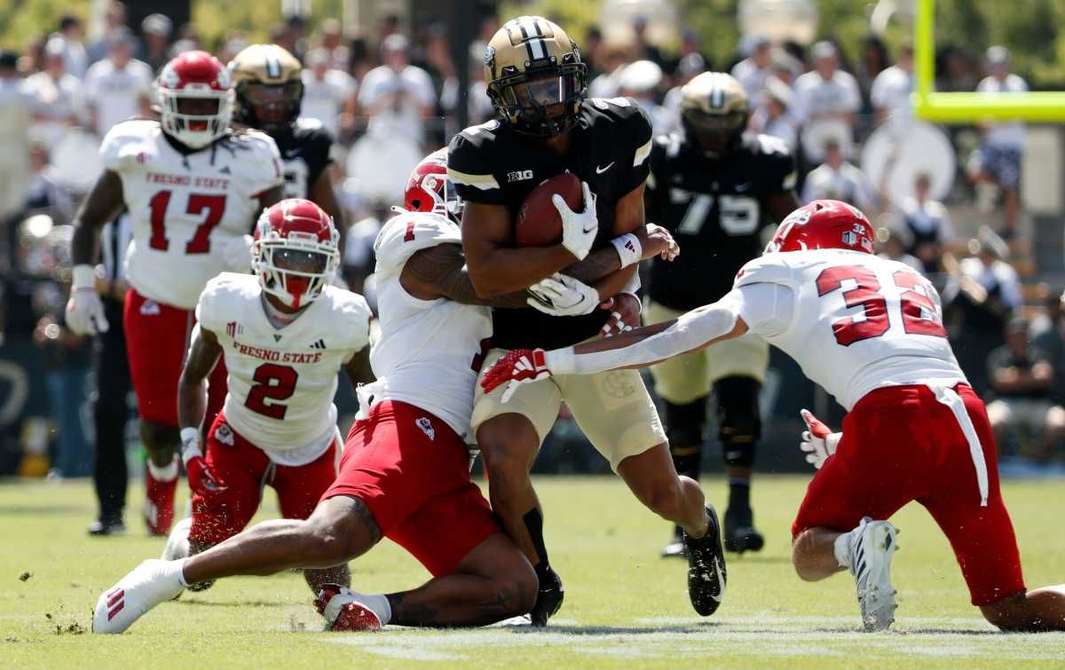 Purdue Boilermakers defensive back Salim Turner-Muhammad (2) is tackled by Fresno State Bulldogs linebacker Raymond Scott (1) and Fresno State Bulldogs defensive back Dean Clark (32) during the NCAA football game, Saturday, Sept. 2, 2023, at Ross-Ade Stadium in West Lafayette, Ind. Fresno State Bulldogs won 39-35.