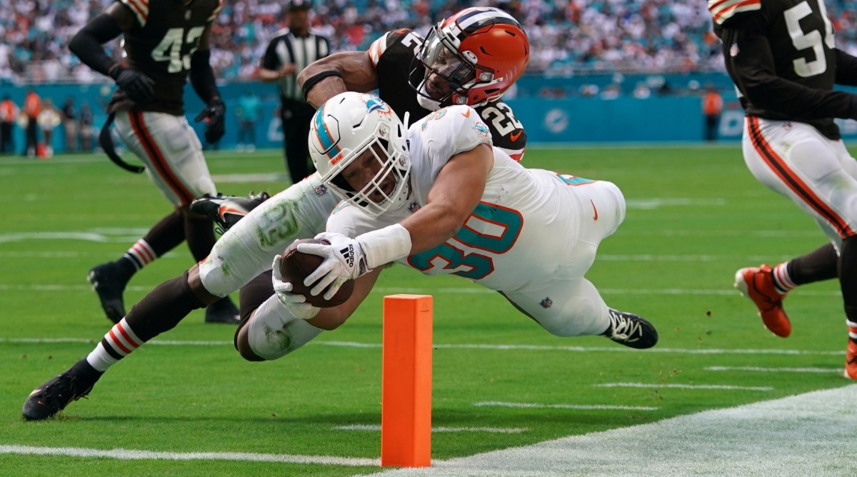 Dolphins fullback Alec Ingold dives for a touchdown