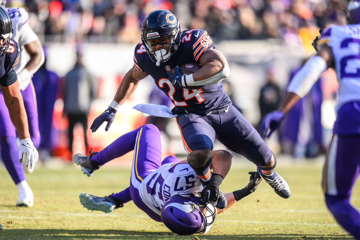Jan 8, 2023; Chicago, Illinois, USA; Chicago Bears running back Khalil Herbert (24) runs the ball and is tackled by Minnesota Vikings linebacker Ryan Connelly (57) during the third quarter at Soldier Field. Mandatory Credit: Daniel Bartel-USA TODAY Sports