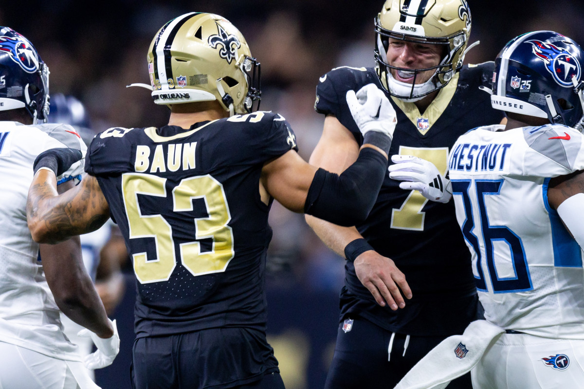 Sep 10, 2023; New Orleans, Louisiana, USA; New Orleans Saints tight end Taysom Hill (7) celebrates with linebacker Zack Baun (53) after he blocked a Tennessee Titans punt during the first half at the Caesars Superdome. Mandatory Credit: Stephen Lew-USA TODAY Sports