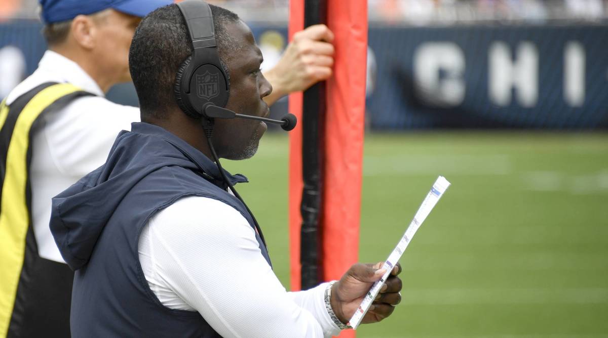 Bears defensive coordinator looks on from the sidelines while coaching in a game.