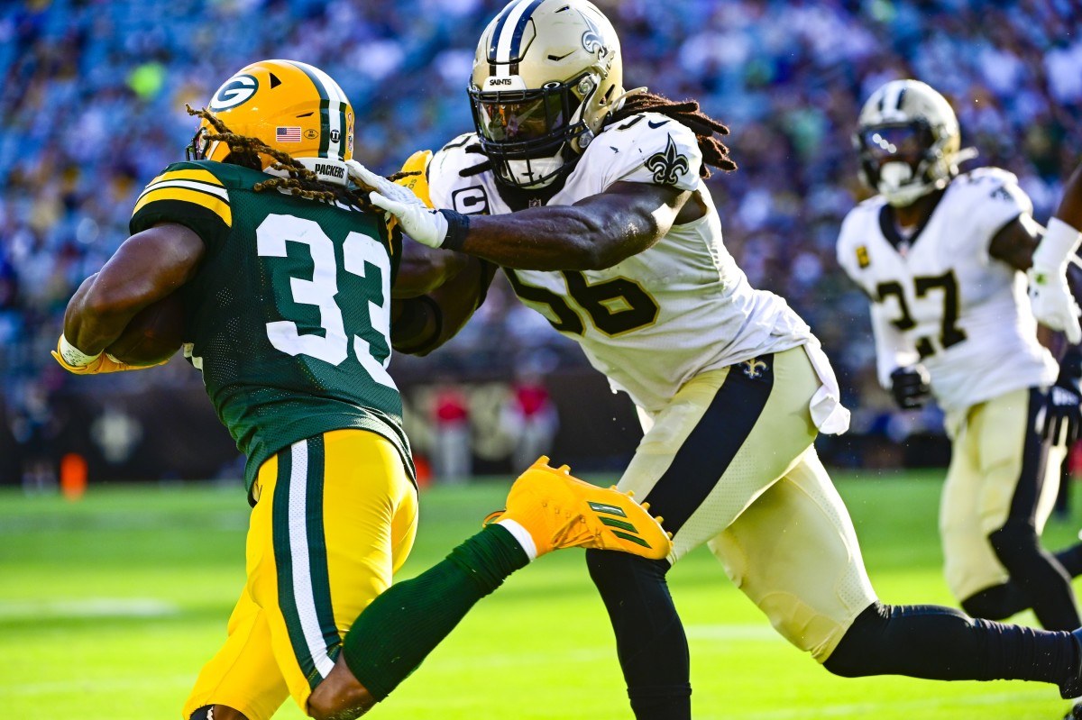 Sep 12, 2021; New Orleans Saints linebacker Demario Davis (56) drives Green Bay Packers running back Aaron Jones (33) out of bounds. Mandatory Credit: Tommy Gilligan-USA TODAY Sports
