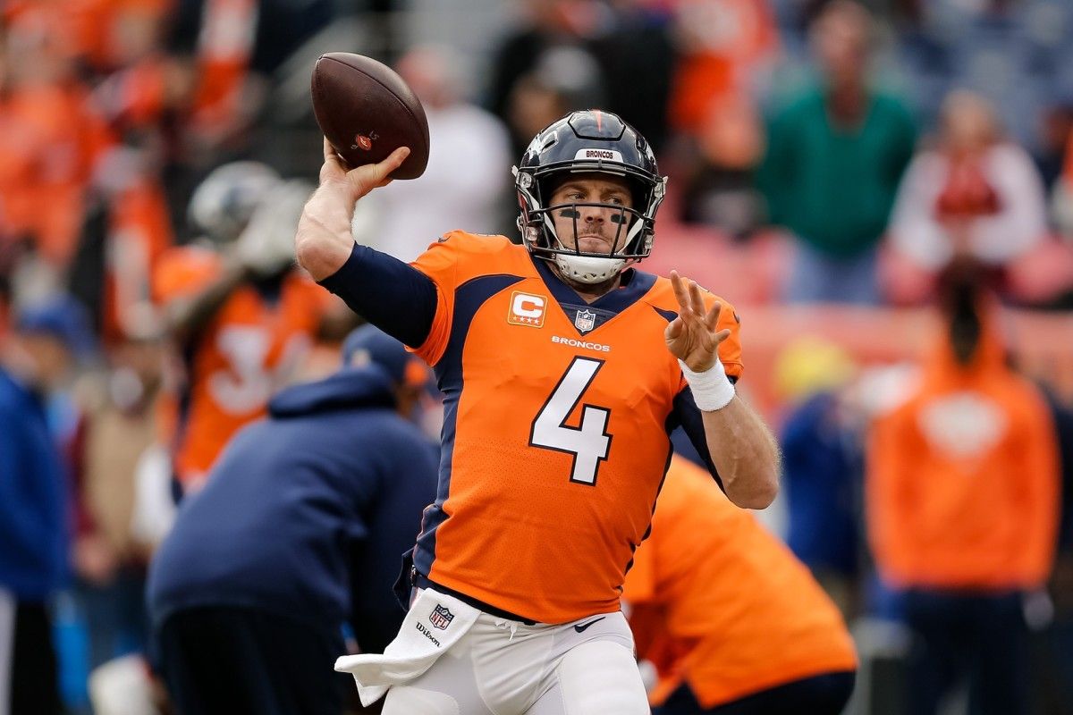 Denver Broncos quarterback Case Keenum (4) warms up before a game against the Los Angeles Chargers at Broncos Stadium at Mile High.