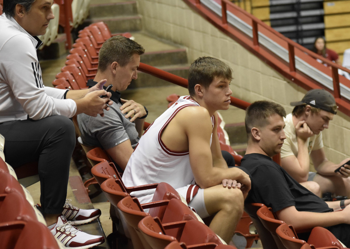 Indiana freshman Gabe Cupps watches the start of Media Day from the seats in Simon Skjodt Assembly Hall.