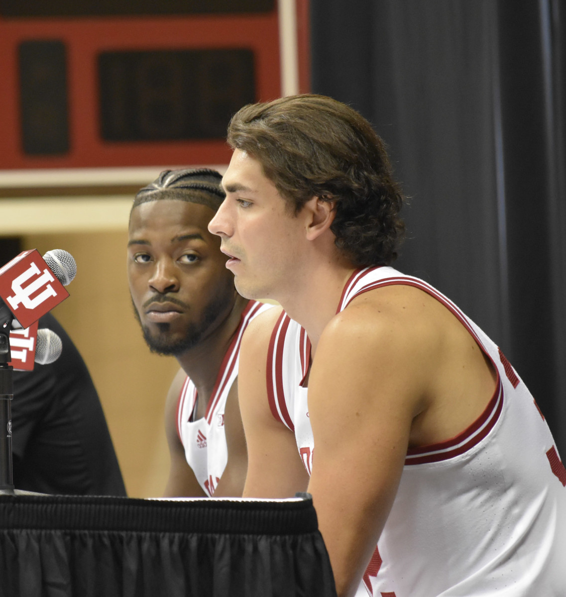 Xavier Johnson and Trey Galloway take turns answering questions from the media on IU Basketball Media Day at Simon Skjodt Assembly Hall on Wednesday.
