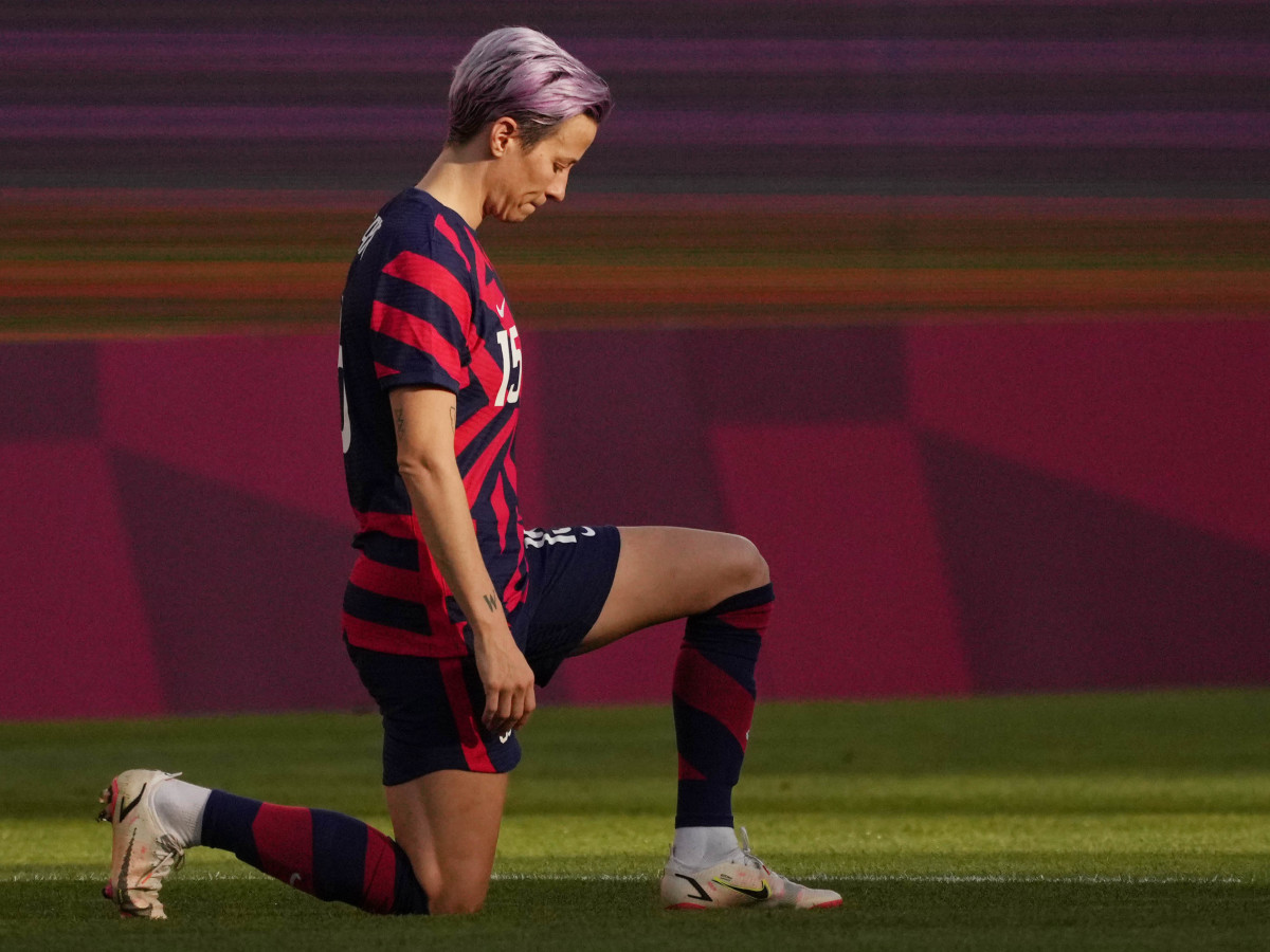 United States forward Megan Rapinoe kneels before the bronze medal match against Australia during the Tokyo 2020 Olympic Summer Games.
