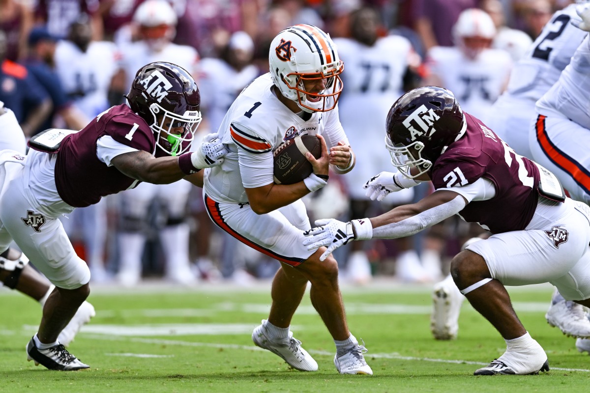 Auburn Tigers quarterback Payton Thorne (1) is tackled by Texas A&M Aggies defensive back Bryce Anderson (1) and linebacker Taurean York (21) during the first quarter at Kyle Field.