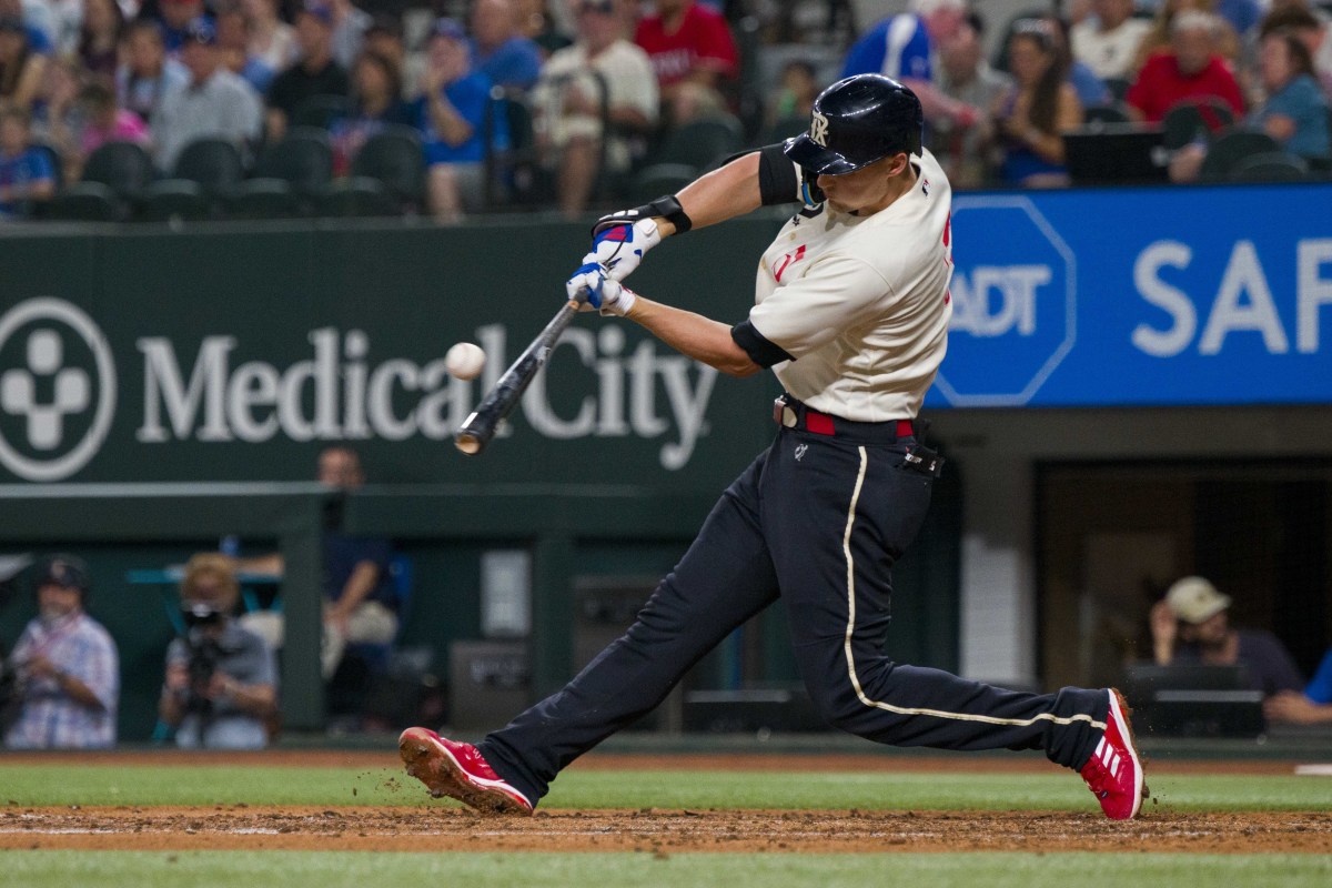 Sep 22, 2023; Arlington, Texas, USA; Texas Rangers shortstop Corey Seager (5) hits a single against the Seattle Mariners during the fifth inning at Globe Life Field. Mandatory Credit: Jerome Miron-USA TODAY Sports