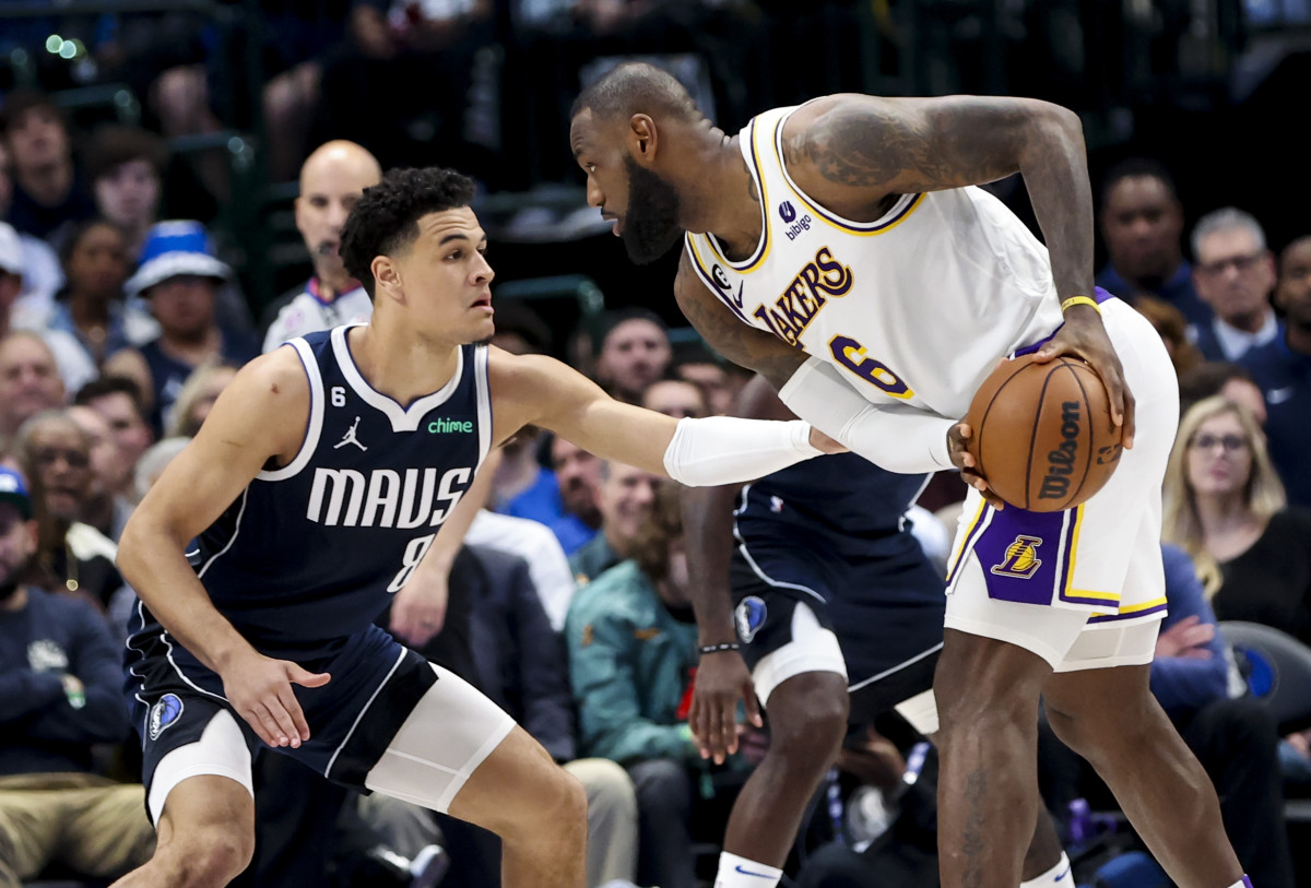 Dallas Mavericks’ Josh Green takes on the tough assignment of guarding Los Angeles Lakers star LeBron James.