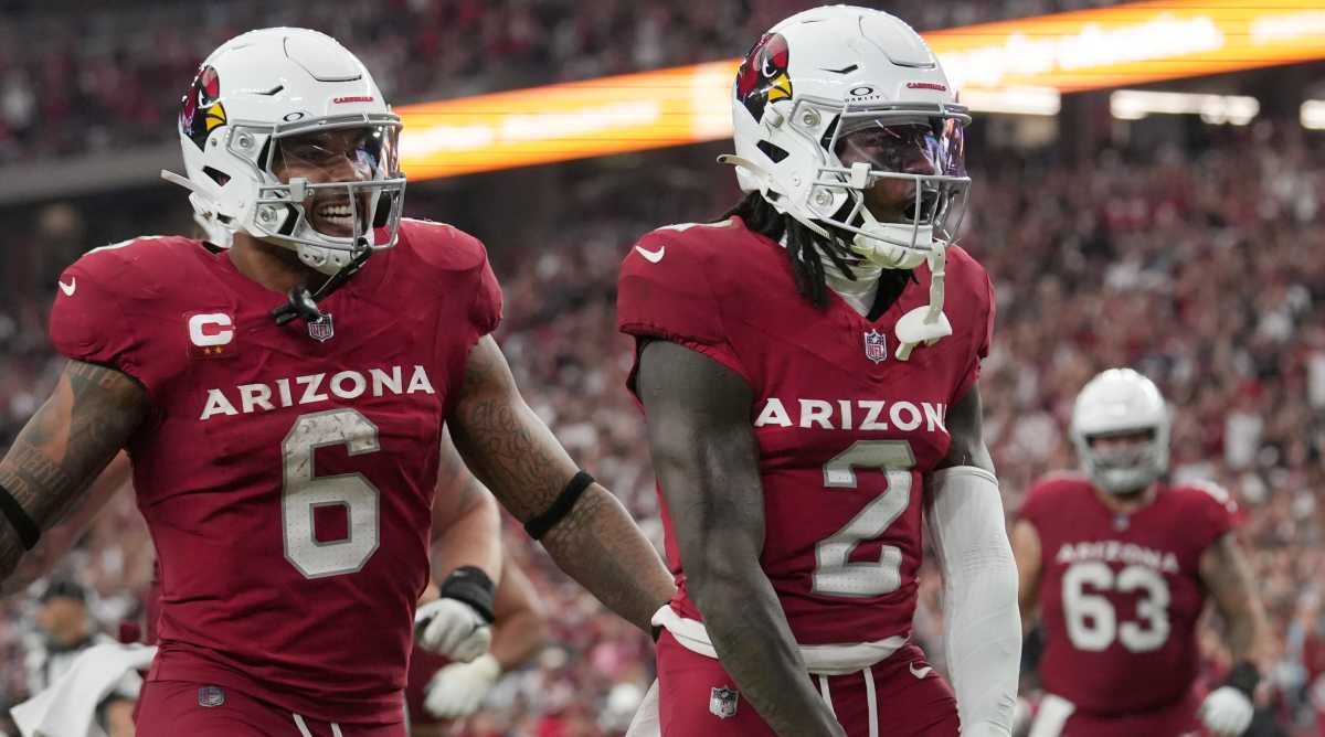 Cardinals receiver Marquise Brown, right celebrates his touchdown with teammate James Conner