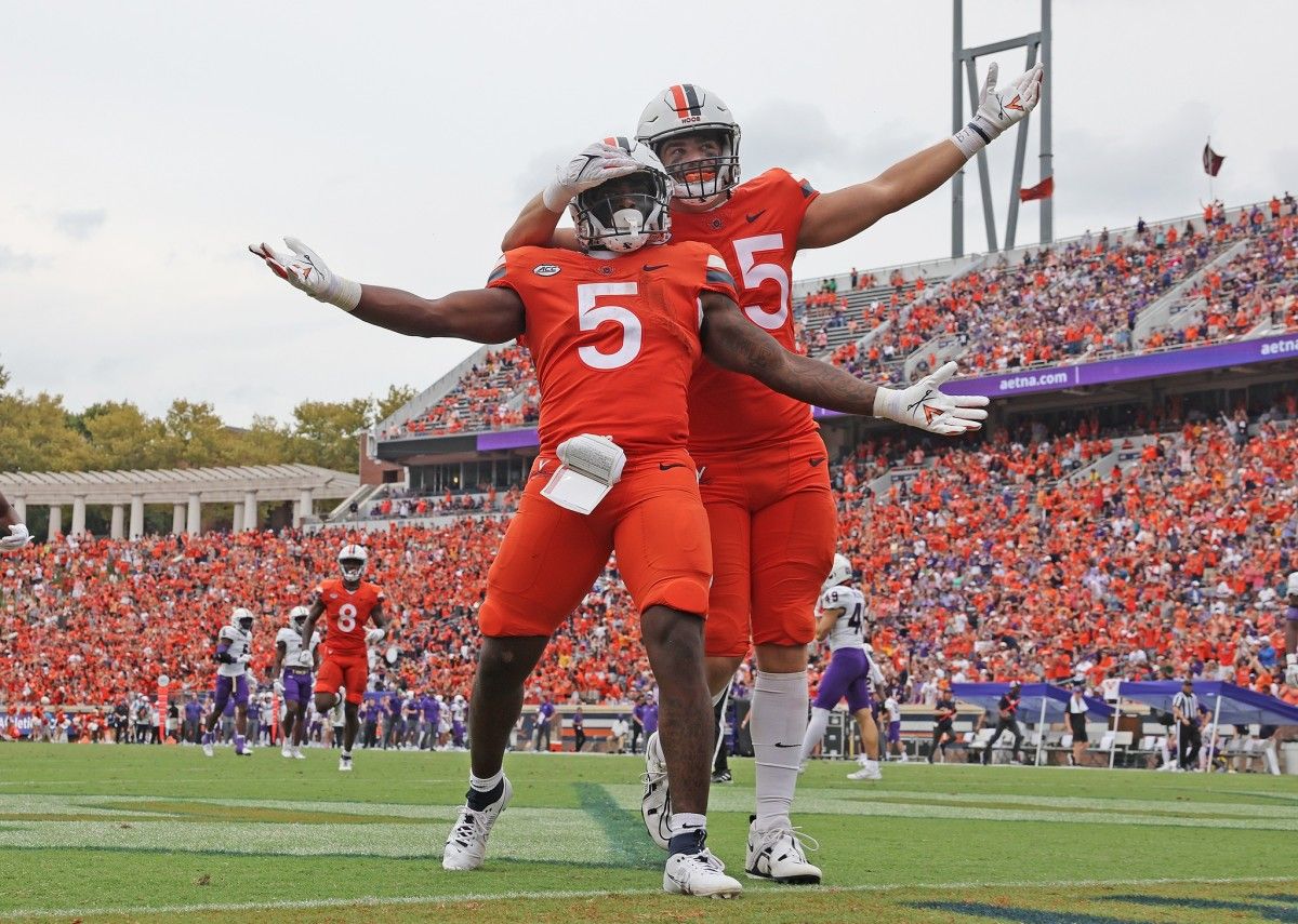 UVA running back Kobe Pace celebrates after scoring a touchdown during the Virginia football game against JMU at Scott Stadium.