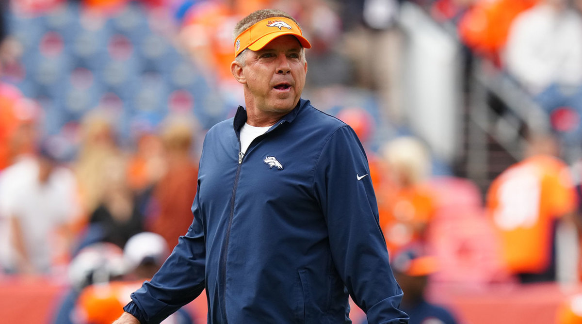 Sean Payton wearing a Broncos visor during pregame