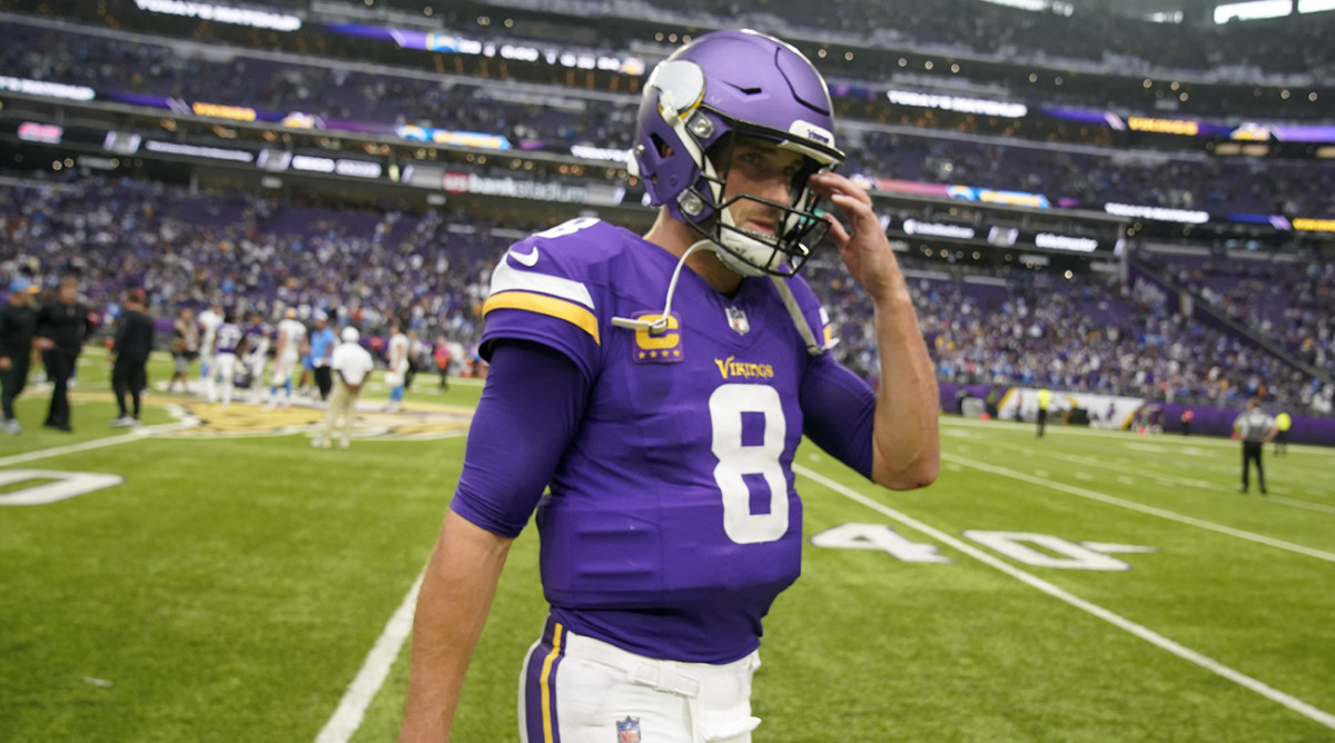 Vikings quarterback Kirk Cousins (8) walks off the field after a loss to the Chargers.
