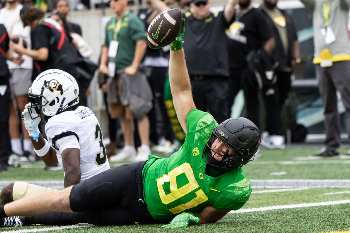 Oregon Ducks tight end Casey Kelly celebrates a touchdown catch against the Colorado Buffaloes.