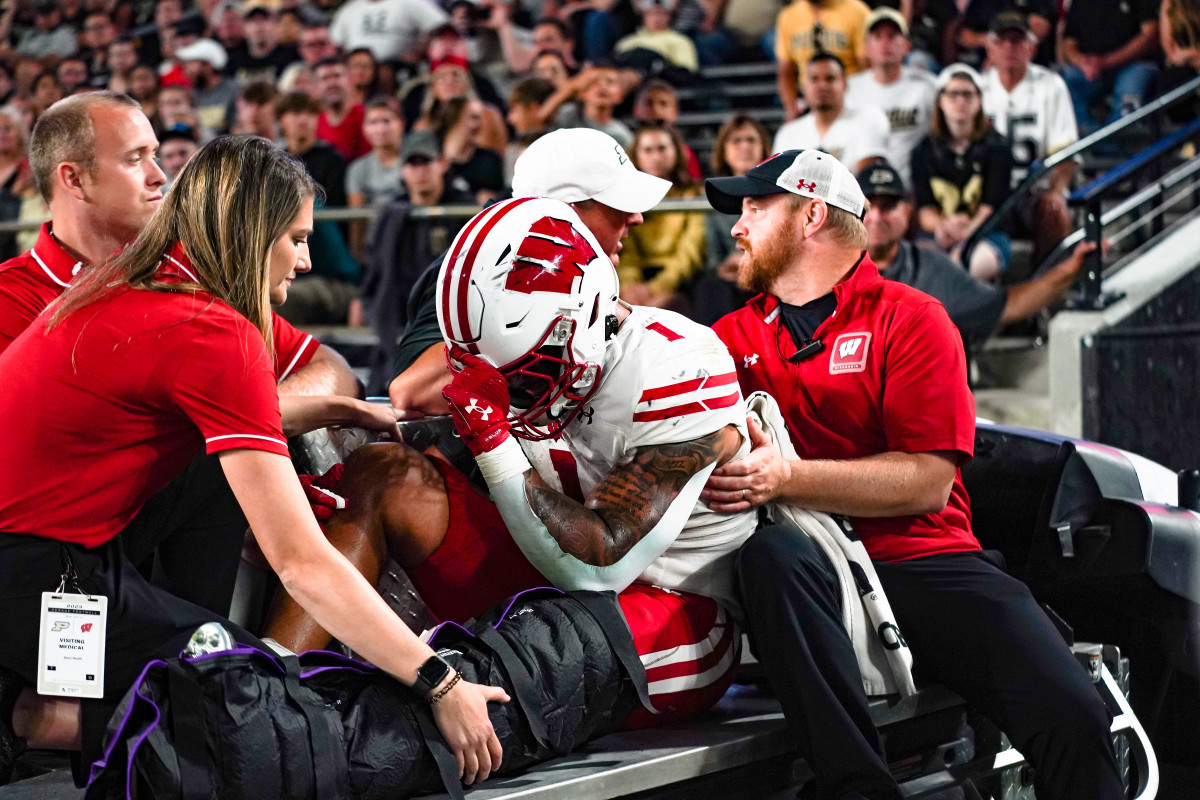 Sep 22, 2023; West Lafayette, Indiana, USA; Wisconsin Badgers running back Chez Mellusi (1) is taken off the field in a cart after suffering an injury during the second half at Ross-Ade Stadium. Mandatory Credit: Robert Goddin-USA TODAY Sports