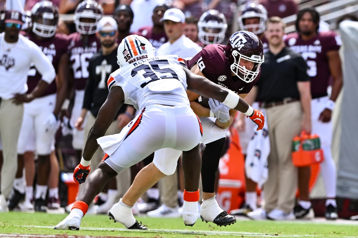 Sep 23, 2023; College Station, Texas, USA; Auburn Tigers linebacker Jalen McLeod (35) tackles Texas A&M Aggies tight end Jake Johnson (19) during the third quarter at Kyle Field. Mandatory