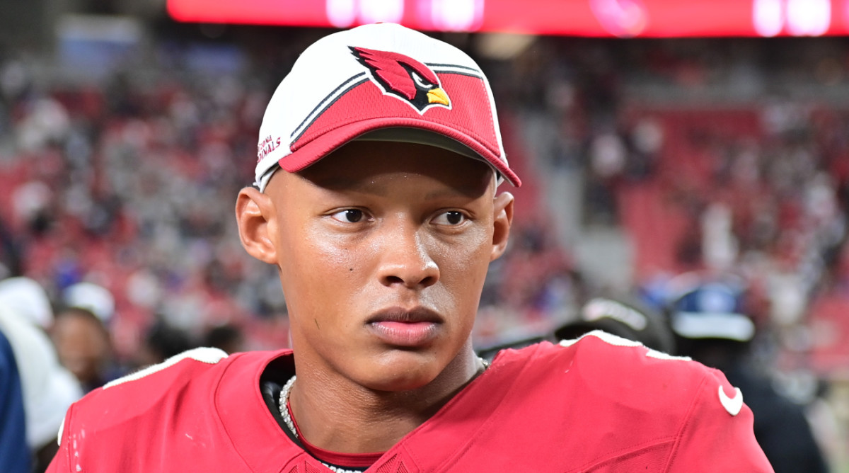 Cardinals quarterback Josh Dobbs looks on after a game.