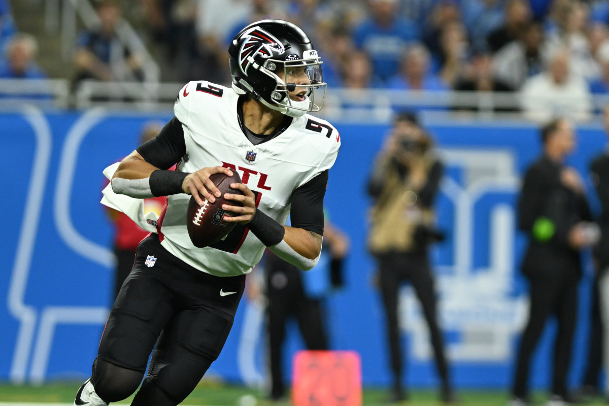 Sep 24, 2023; Detroit, Michigan, USA; Atlanta Falcons quarterback Desmond Ridder (9) rolls out of the pocket against the Detroit Lions in the first quarter at Ford Field.