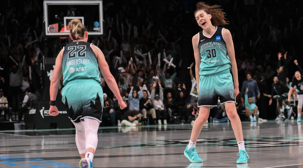 New York Liberty forward Breanna Stewart celebrates with Courtney Vandersloot after scoring against the Connecticut Sun during the WNBA playoffs.