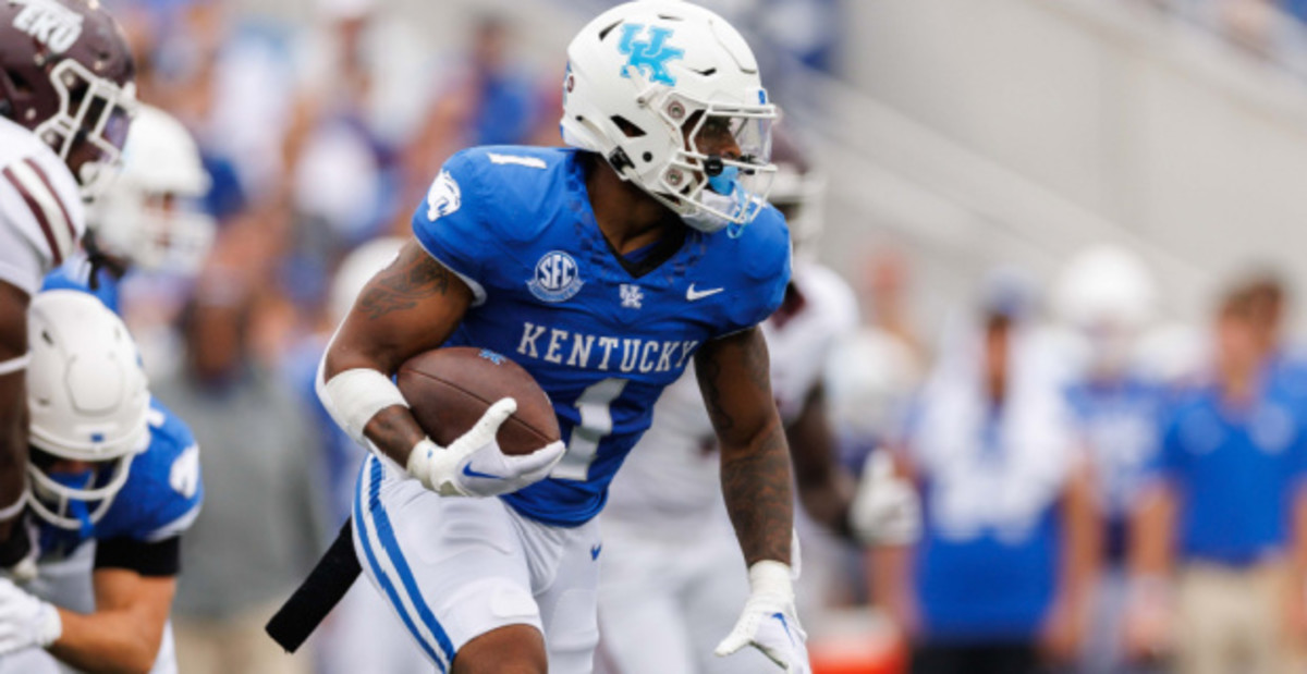Kentucky Wildcats tailback Ray Davis on a rushing attempt during a college football game in the SEC.