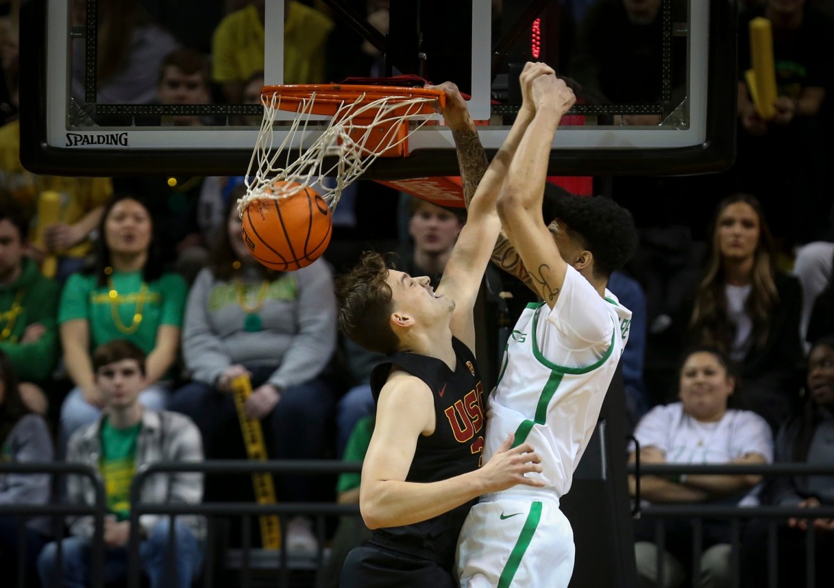 Oregon center Kel'el Ware dunks the ball as the Ducks host the Southern California Trojans Thursday, Feb. 9, 2023, at Matthew Knight Arena in Eugene, Ore.
