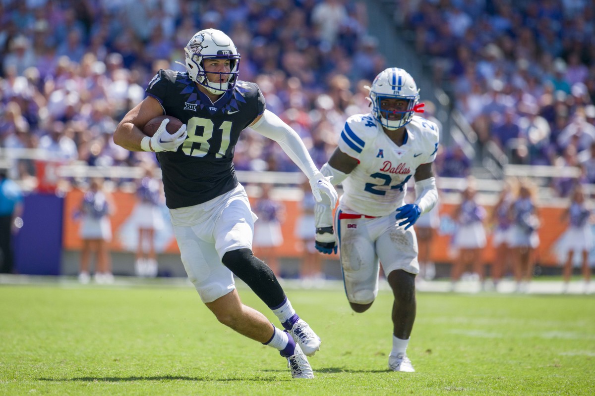 TCU Horned Frogs tight end Chase Curtis (81) catches a pass for a first down against the SMU Mustangs during the second half at Amon G. Carter Stadium.