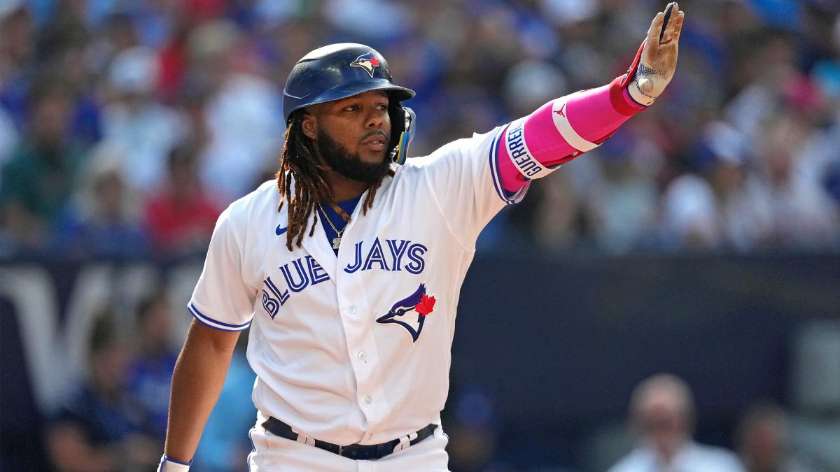 Blue Jays first baseman Vladimir Guerrero Jr. gestures toward teammate George Springer