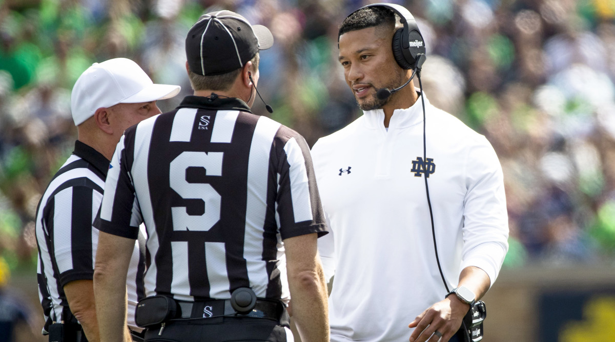 Notre Dame head coach Marcus Freeman talks with officials during a game against Central Michigan.