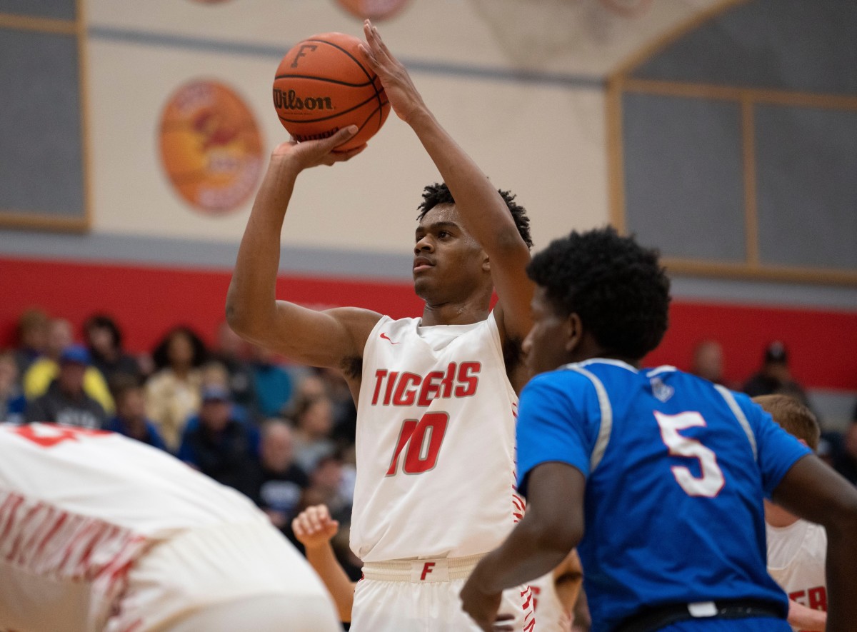 Fishers Tigers guard Jalen Haralson (10) shoots a free throw Friday, Dec. 16, 2022 at Fishers High School.