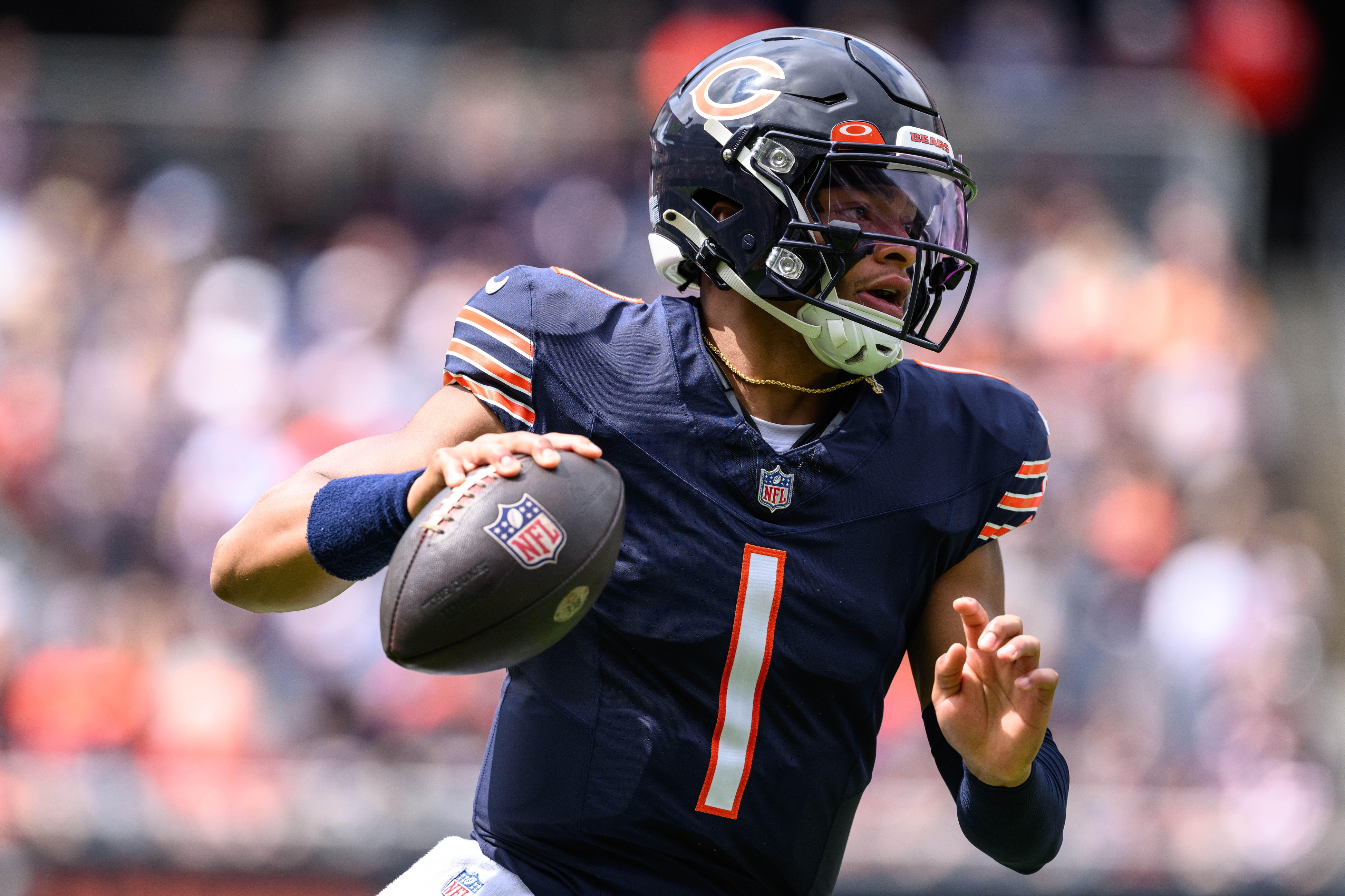 Chicago Bears quarterback Justin Fields (1) scrambles against the Buffalo Bills during the first quarter at Soldier Field.
