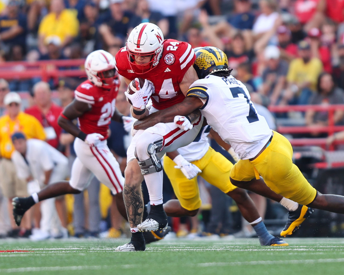 Thomas Fidone is tackled after making a catch for 17 yards and a first down during the fourth quarter against Michigan in 2023.