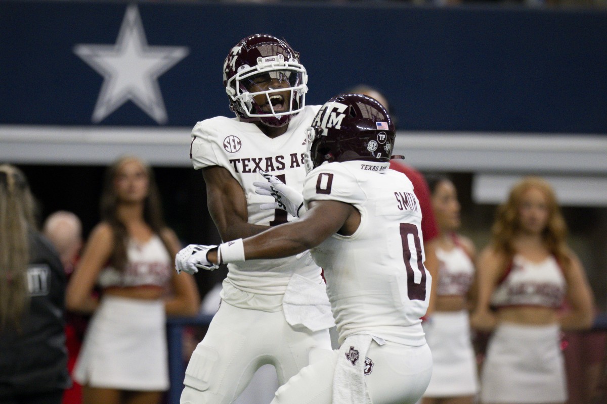 Sep 30, 2023; Arlington, Texas, USA; Texas A&M Aggies wide receiver Evan Stewart (1) and wide receiver Ainias Smith (0) celebrate after Stewart catches a pass for a touchdown against the Arkansas Razorbacks during the first half at AT&T Stadium.