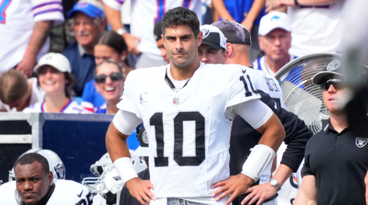 Jimmy Garoppolo stands on the Raiders’ sideline during a game with the Bills.