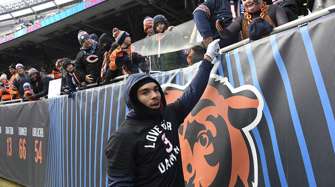 Bears wide receiver Chase Claypool (10) high-fives fans before the team’s game against the Vikings at Soldier Field.