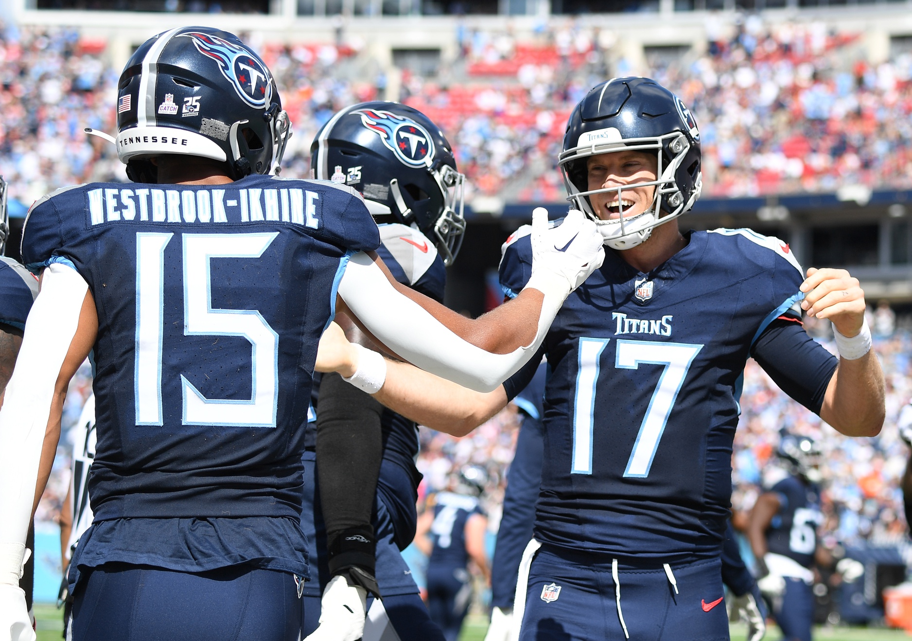 Tennessee Titans wide receiver Nick Westbrook-Ikhine (15) celebrates with quarterback Ryan Tannehill (17) after a touchdown during the first half against the Cincinnati Bengals at Nissan Stadium. 