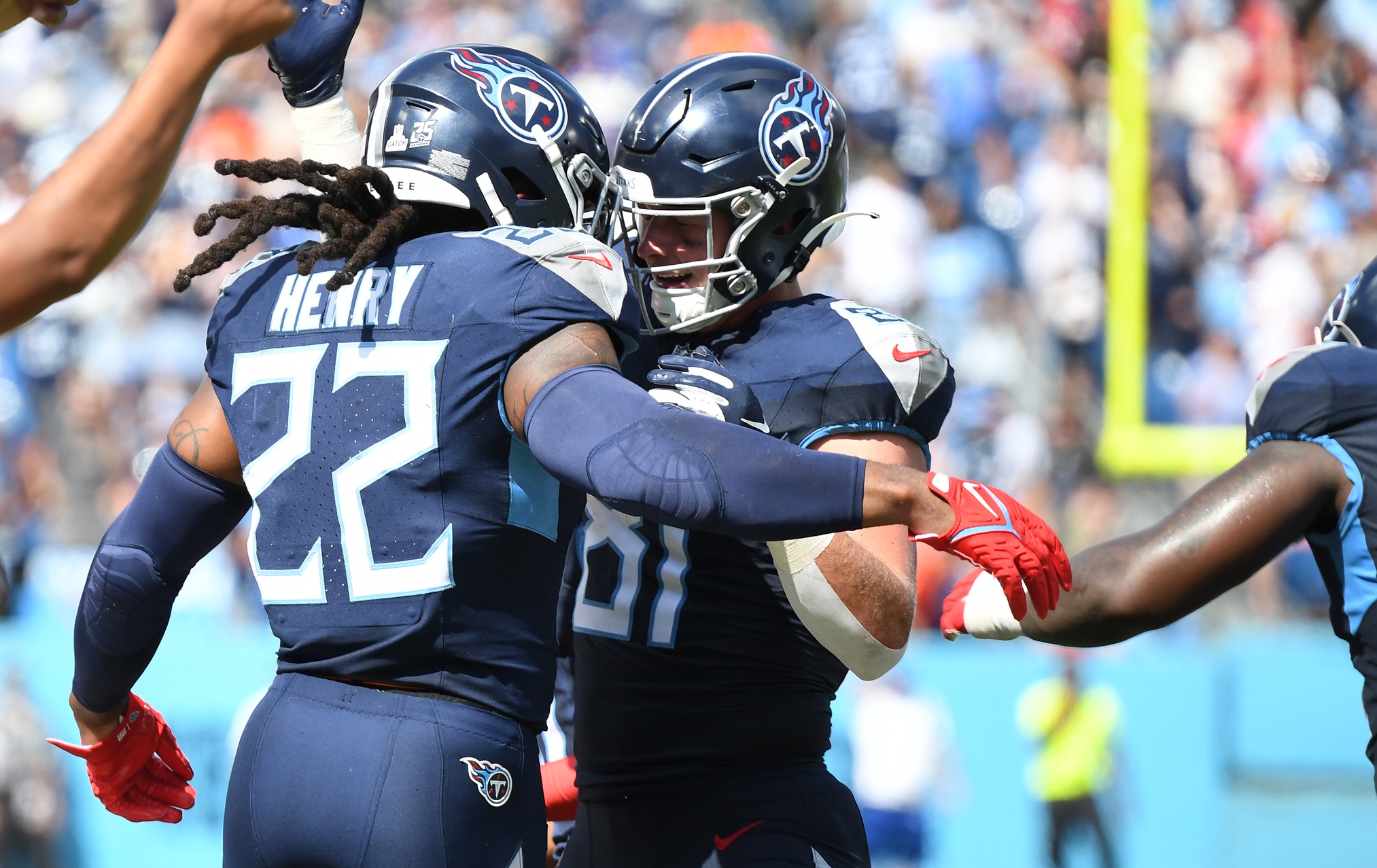 Tennessee Titans tight end Josh Whyle (81) celebrates with running back Derrick Henry (22) after catching a touchdown pass from Henry during the first half against the Cincinnati Bengals at Nissan Stadium.
