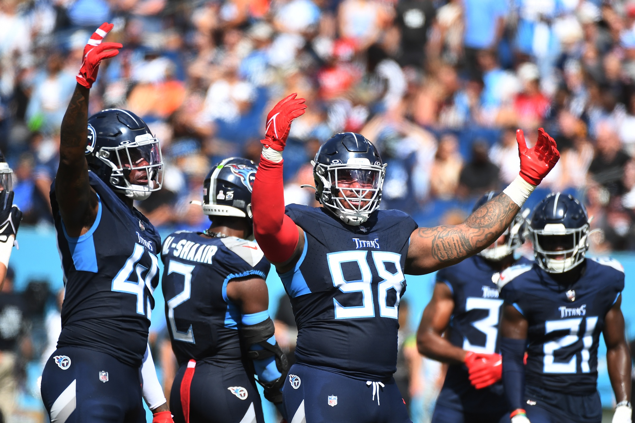Jeffery Simmons and the Tennessee Titans defense celebrate a stop against the Bengals.