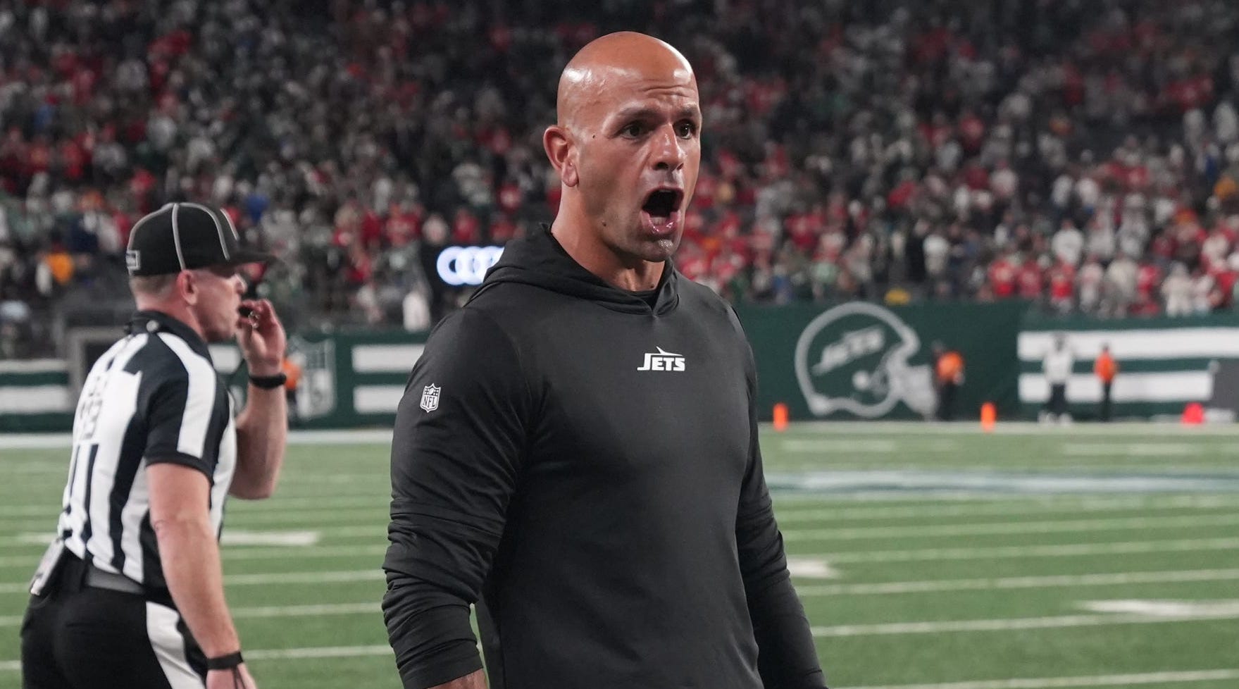 Jets coach Robert Saleh argues a call