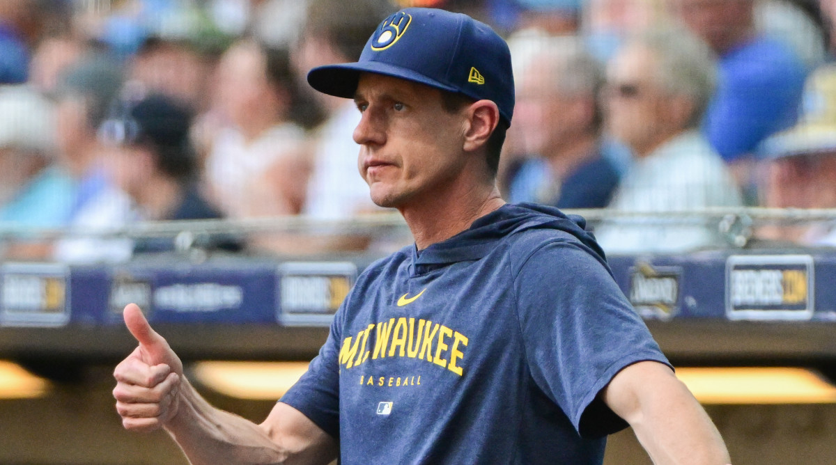 Brewers manager Craig Counsell gies a thumbs-up from the dugout