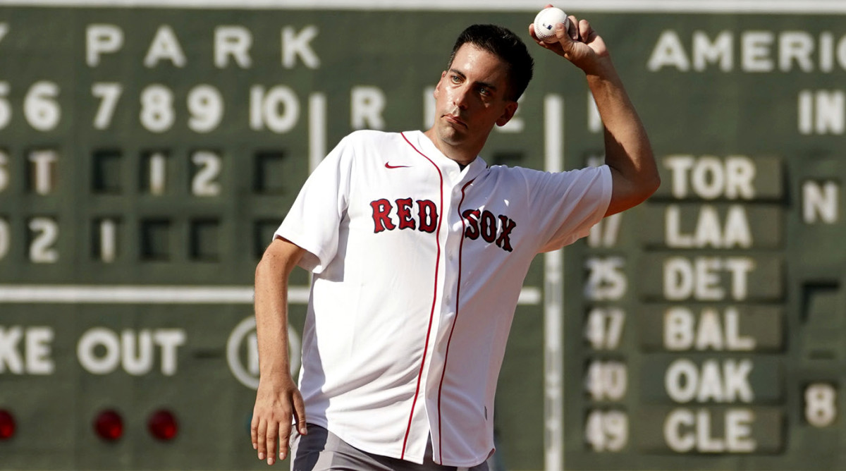 Chris Snow, an assistant general manager for the Calgary Flames, throws out a ceremonial first pitch before a Boston Red Sox baseball game in 2021.