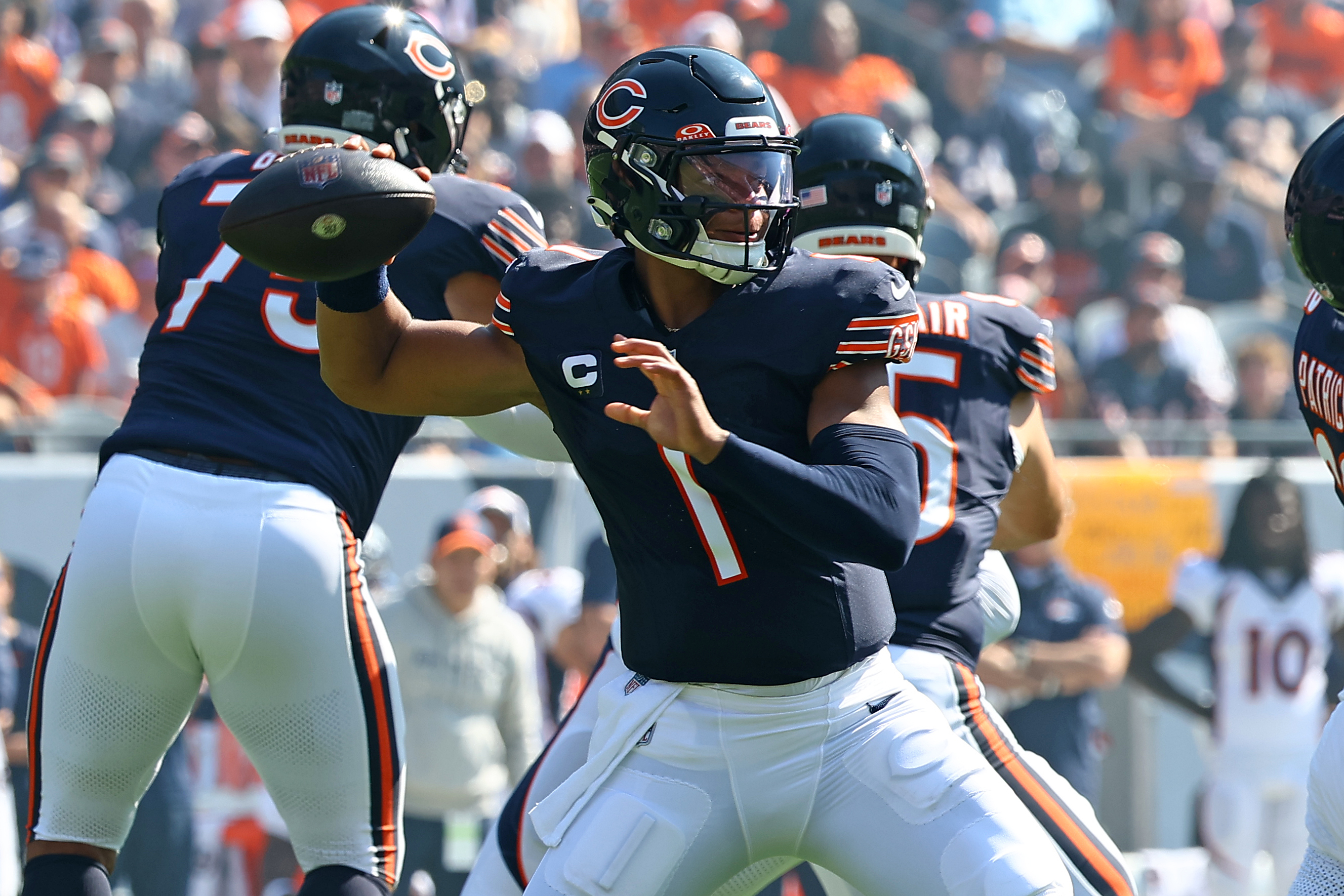 Chicago Bears quarterback Justin Fields throwing a pass against the Denver Broncos.
